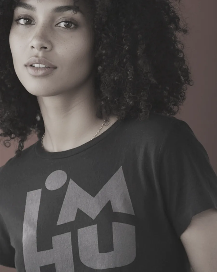 Close portrait of a model in the black I’M HUMAN tee